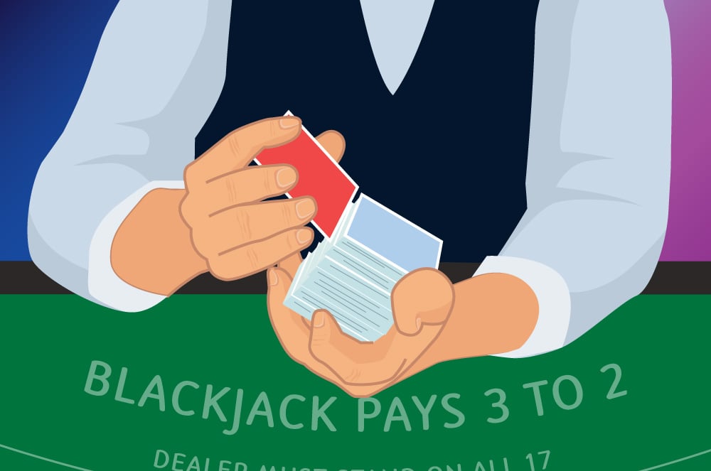 dealer holds with one hand and places red cut-card near the end of the deck with her other hand